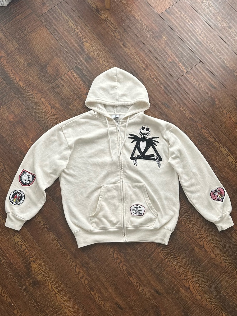 Disney womans Cream Hoodie with nightmare before Christmas jack on.